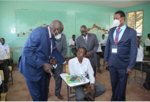 Clear photo of Education PS Belio Kipsang in a national examination room interrogating a candidate. /Photo courtesy 